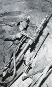 A “Buzzyman” drill operator at Climax mine.
