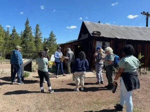 A tour group learns about the Matchless Claim and geology.
