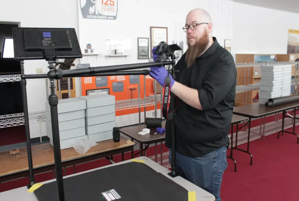 Registrar Shane Kinney cataloging mining artifacts