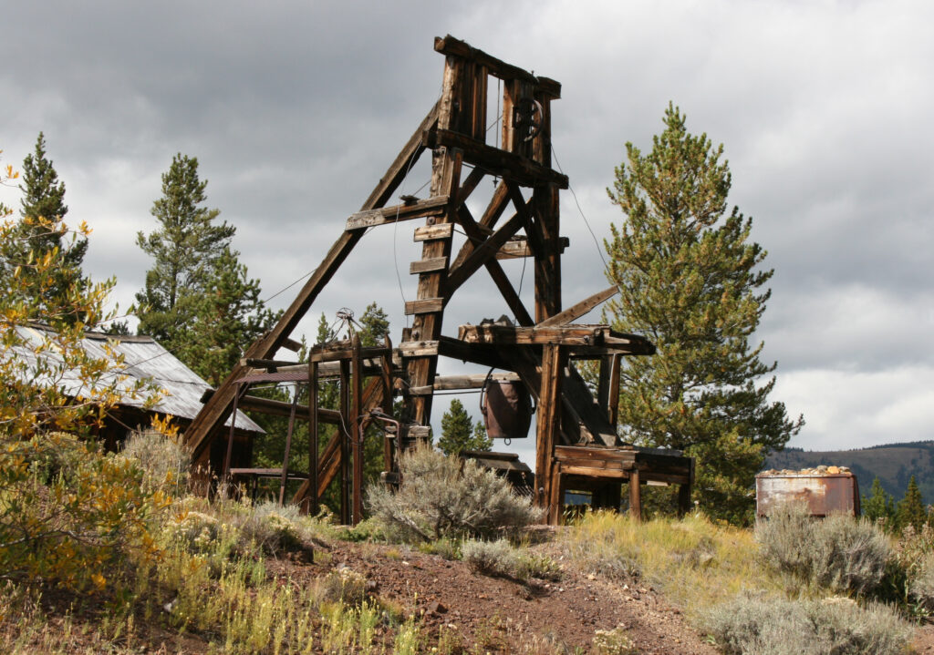 Matchless Mine Historic Site headframe and surrounding foliage