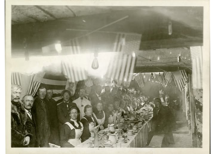 old photo of the Wolftone Mine underground dinner party